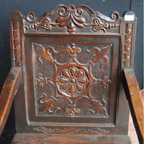 365 - Oak Wainscot chair, c. late 17th/early 18th century, decorated with fleur de lys motifs and a floral... 