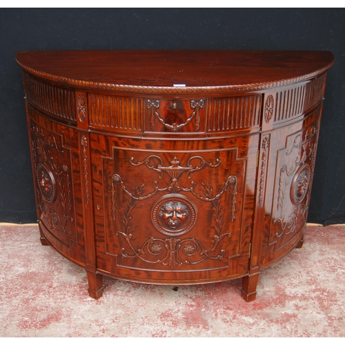 366 - Mahogany commode of demi-lune shape in the 18th century style, with a drawer above a cupboard door e... 