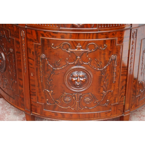 366 - Mahogany commode of demi-lune shape in the 18th century style, with a drawer above a cupboard door e... 