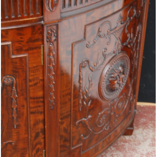 366 - Mahogany commode of demi-lune shape in the 18th century style, with a drawer above a cupboard door e... 