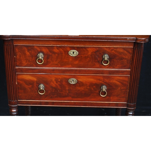 368 - Regency Scottish mahogany work table with two drawers, lion mask ring handles, on ornate reeded legs... 