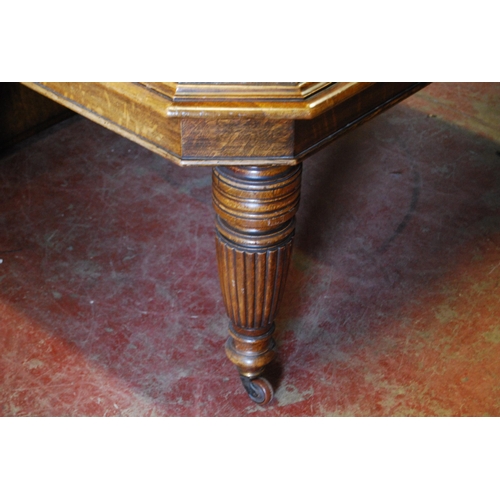 376 - Late Victorian oak extending dining table with two additional leaves, on reeded baluster legs and ca... 