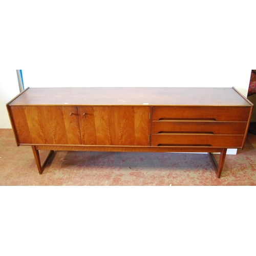 378 - Mid-20th century teak dining room suite comprising a sideboard, extending dining table, 76cm high, 1... 