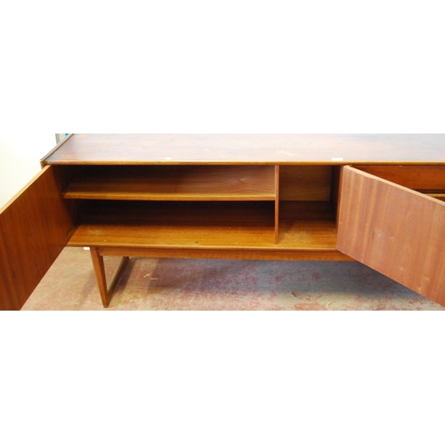 378 - Mid-20th century teak dining room suite comprising a sideboard, extending dining table, 76cm high, 1... 