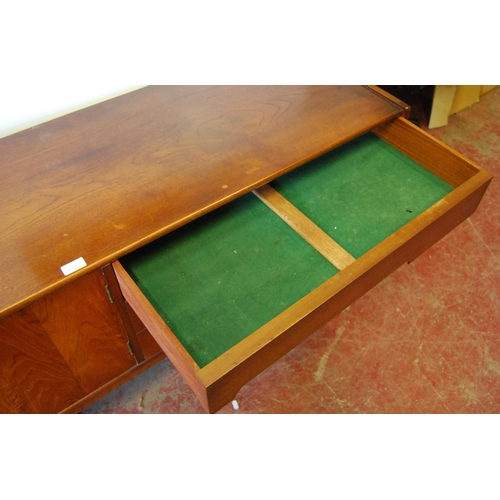 378 - Mid-20th century teak dining room suite comprising a sideboard, extending dining table, 76cm high, 1... 