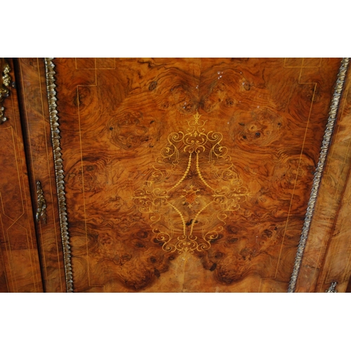 379 - Late Victorian inlaid walnut credenza with a central inlaid door flanked bowfront glazed doors enclo... 