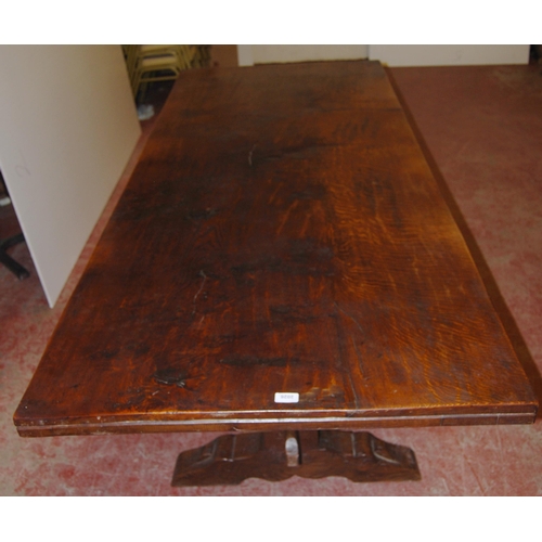 385 - Jack Grimble of CromerOak and elm refectory table with large plank top, on twin trestle supports uni... 