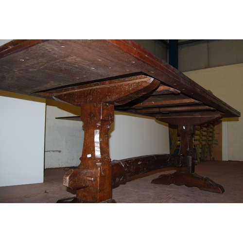 385 - Jack Grimble of CromerOak and elm refectory table with large plank top, on twin trestle supports uni... 