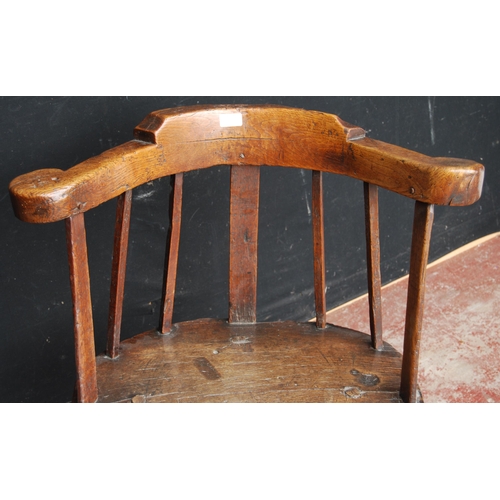 390 - 18th century primitive ash and elm Windsor armchair with low back rest, scroll frame, stick and rail... 