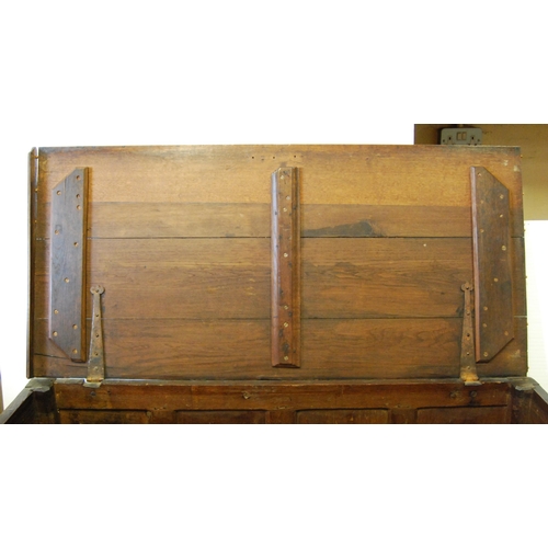 394 - George II period oak and elm coffer with hinged top, inscribed to the frieze 'WCM 1731', above panel... 