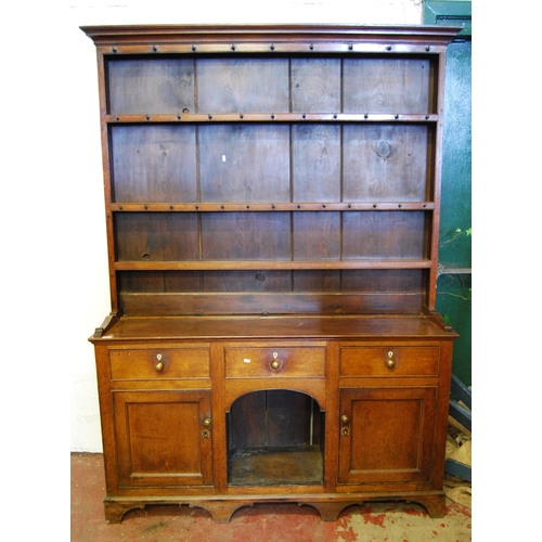 395 - George III style oak Welsh dresser, c. 19th century, the top section with open Delft racks and multi... 