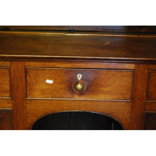 395 - George III style oak Welsh dresser, c. 19th century, the top section with open Delft racks and multi... 