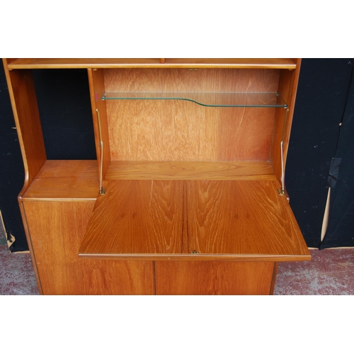 398 - Retro teak display cabinet by S Form, with sliding glazed doors above open shelving and a fall front... 