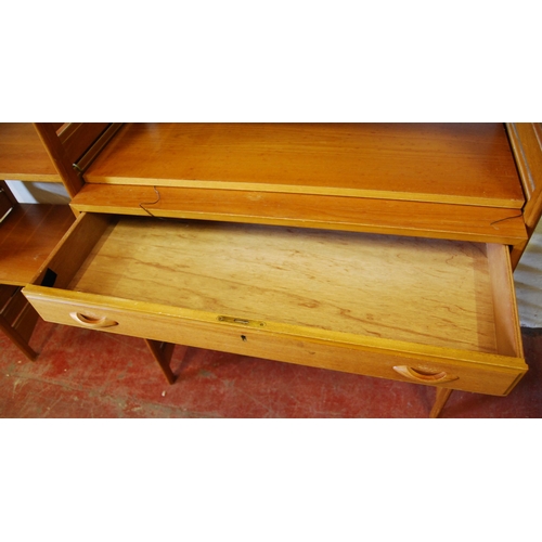 404 - Teak Ladderax unit, c. 1960s, with sliding doors to the top above open shelving and a drawer, flanke... 