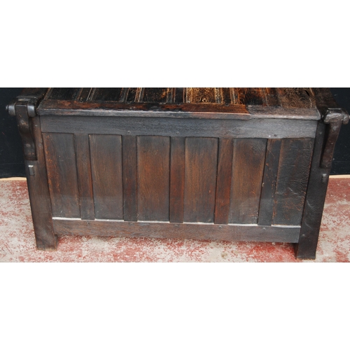 405 - Oak coffer, the hinged top and front with fielded panelling, naturalistic-style handles, on animal p... 