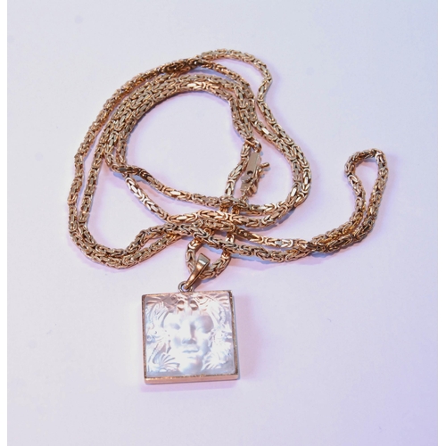 68 - Lalique glass pendant with moulded mask, on a necklet of square section, '750', 31g.