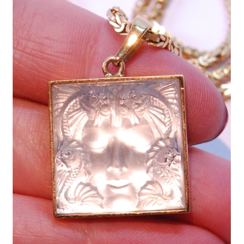 68 - Lalique glass pendant with moulded mask, on a necklet of square section, '750', 31g.