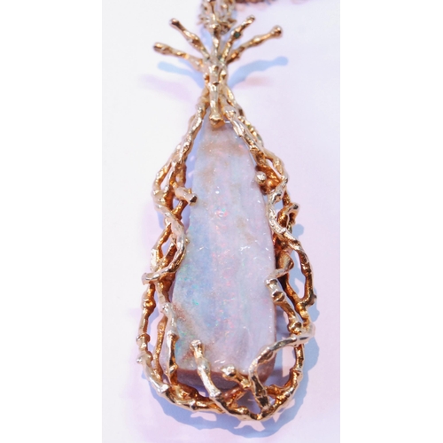 73 - Opal matrix pendant of tapering shape with 9ct gold twiggy mount, 29g gross, on 9ct gold necklet (11... 