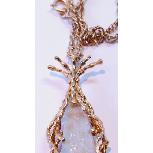 73 - Opal matrix pendant of tapering shape with 9ct gold twiggy mount, 29g gross, on 9ct gold necklet (11... 