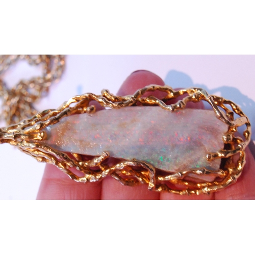 73 - Opal matrix pendant of tapering shape with 9ct gold twiggy mount, 29g gross, on 9ct gold necklet (11... 