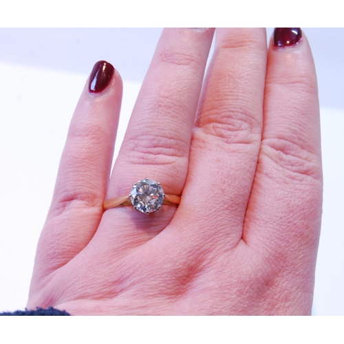 74 - Diamond solitaire ring, the brilliant approximately 2.7ct, in platinum and 18ct gold, size V.