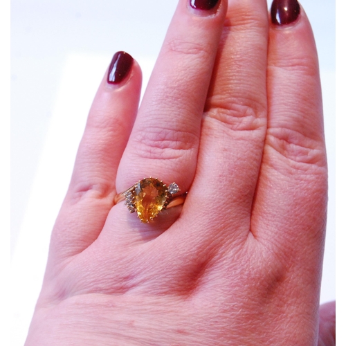 75 - Citrine ring with angled pear-shaped citrine and four diamonds, in 18ct gold, 1992.