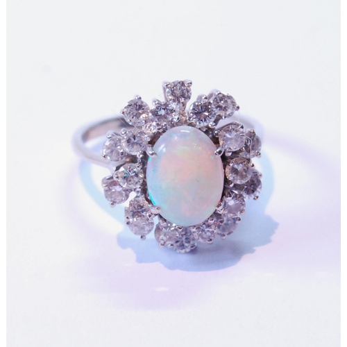 80 - Opal and diamond oval cluster ring with two tiers of brilliants, in white gold, '18ct', size Q.