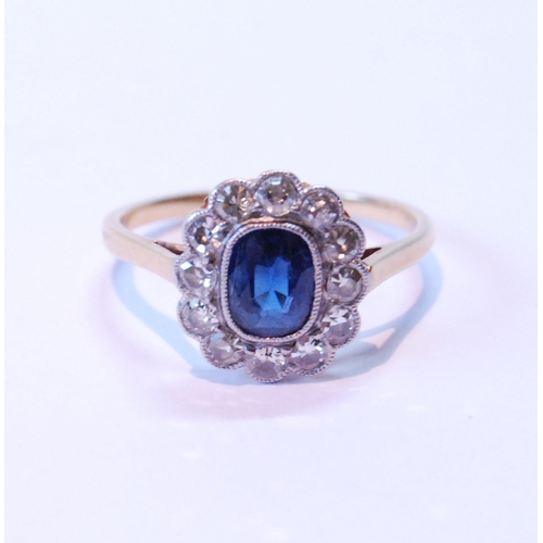 86 - Diamond and sapphire oval cluster ring with twelve old-cut brilliants, all millegrain, in '18ct' and... 