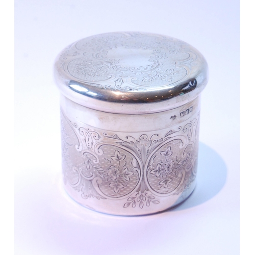 10 - Silver cylindrical box with engraved scrolls and engine turning, by Goldsmiths & Silversmiths Co... 