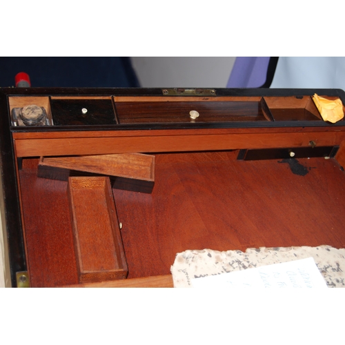 175 - Victorian rosewood writing slope with brass stringing, mounts and carry handles, enclosing a velour-... 