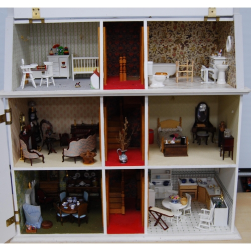 207 - Painted wood doll's house of large size with door opening to reveal six rooms with furnishings, 81cm... 