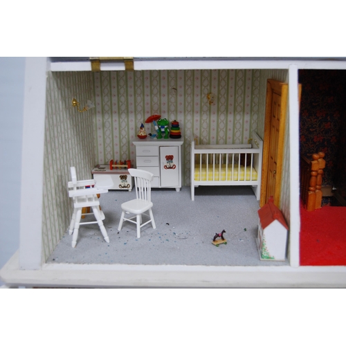 207 - Painted wood doll's house of large size with door opening to reveal six rooms with furnishings, 81cm... 