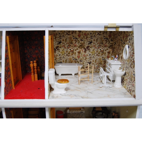 207 - Painted wood doll's house of large size with door opening to reveal six rooms with furnishings, 81cm... 