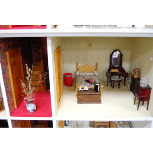 207 - Painted wood doll's house of large size with door opening to reveal six rooms with furnishings, 81cm... 