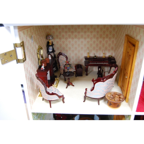 207 - Painted wood doll's house of large size with door opening to reveal six rooms with furnishings, 81cm... 