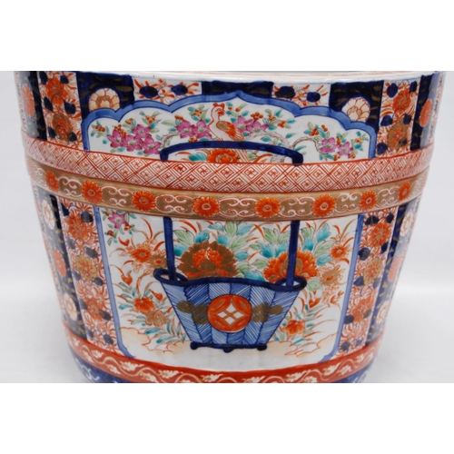 288 - Oriental jardinière in the Chinese style decorated with Imari, famille rose and Kangxi-style scrolls... 