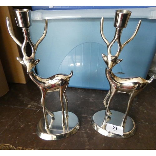 71 - Pair of white metal stag candlesticks.