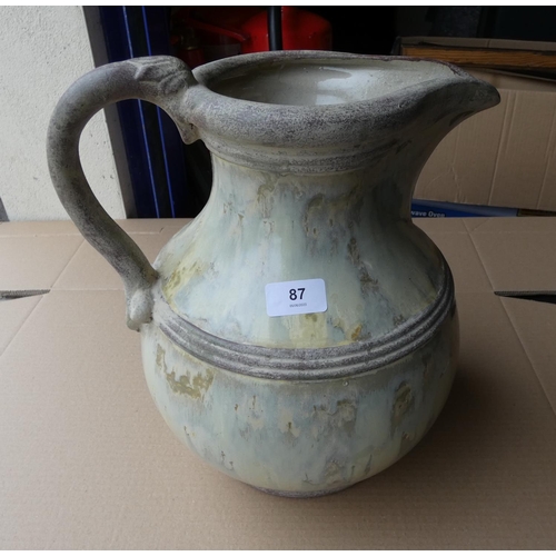 87 - Studio pottery jug.