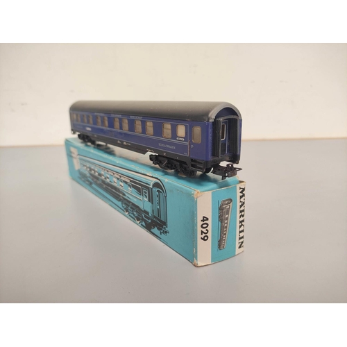 144 - Marklin Railways. Collection of 00 gauge engines, rolling stock and track comprising of TM800 locomo... 