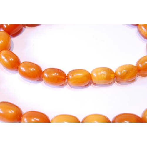 115 - Amber graduated bead necklace, 85g.