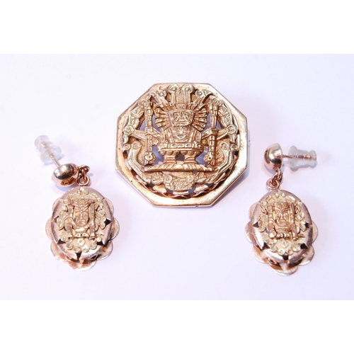 119 - Peruvian gold octagonal brooch with typical embossed decoration with similar drop earrings, '18kt', ... 