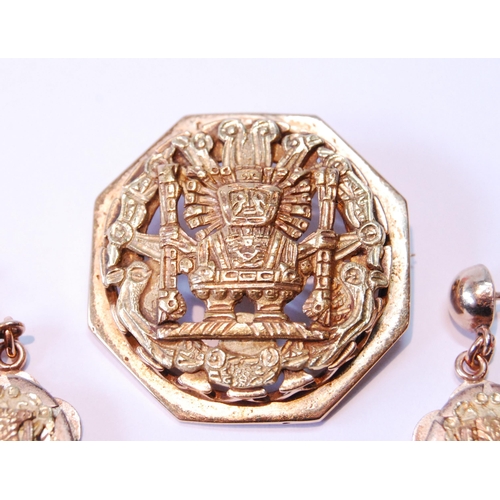 119 - Peruvian gold octagonal brooch with typical embossed decoration with similar drop earrings, '18kt', ... 