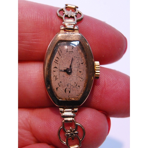 156 - 9ct gold lady's watch, 1925, on rolled gold bracelet.