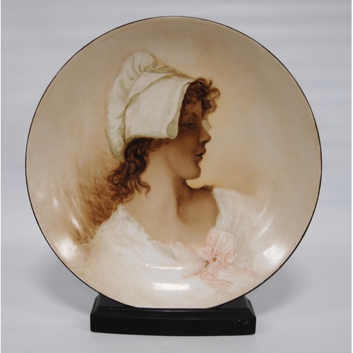 231 - Rosenthal of Bavaria porcelain charger depicting a portrait of a maiden, on painted hardwood stand, ... 