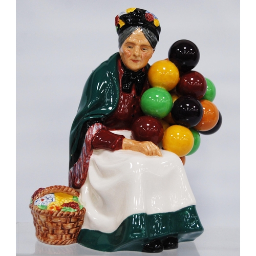 242 - Royal Doulton figures, 'The Old Balloon Seller', HN 1315, 16cm high, 'The Balloon Man', HN 1954, 18c... 