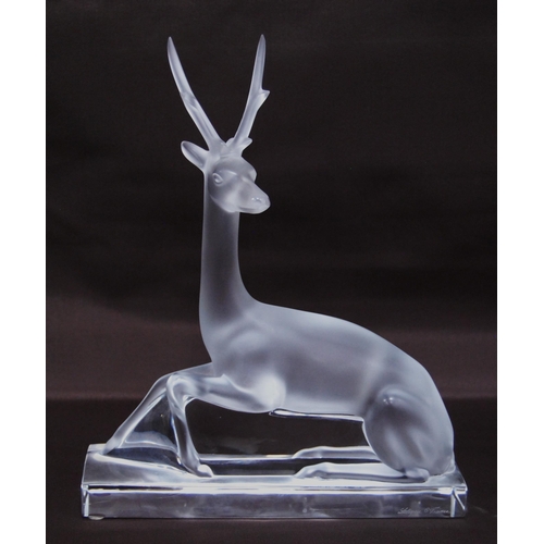 216 - Lalique of France clear and frosted glass figure of a seated deer (20th century) probably designed b... 