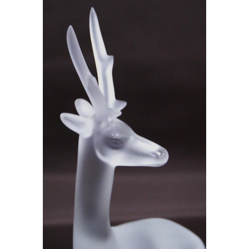 216 - Lalique of France clear and frosted glass figure of a seated deer (20th century) probably designed b... 