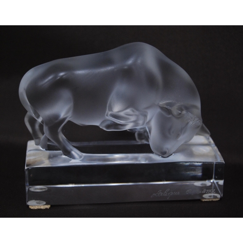 220 - Lalique of France clear and frosted glass figure in the form of a bull (20th century) on a fixed pli... 