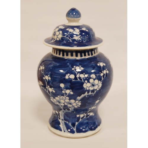 271 - Chinese blue and white vase and cover of baluster form with flowering prunus trees, bearing four cha... 