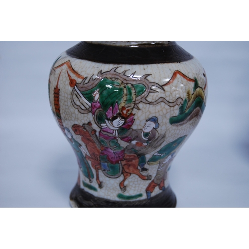 289 - Pair of Chinese crackle glazed baluster vases and covers (20th century) decorated with battle scenes... 